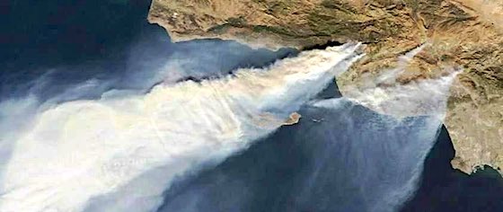 Wildfires burn around Magic Mountain in Southern California