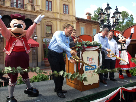 Mickey and Minnie help cut the ribbon to open Via Napoli
