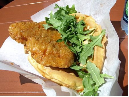 The fried chicken waffle sandwich, with sweet and sour syrup and arugula.
