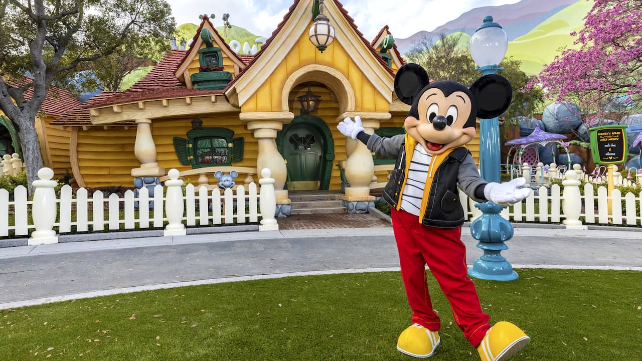 Mickey Mouse in front of his house