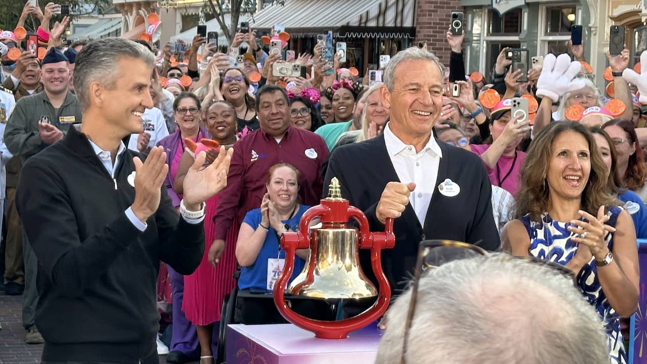 Disney Experiences Chairman Josh D'Amaro applauds as CEO Bob Iger rings the NYSE's opening bell